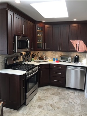 Oceanside kitchen 
ebony cabinet with white quartz